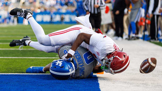 Nov 11, 2023; Lexington, Kentucky, USA; Alabama Crimson Tide defensive back Kool-Aid McKinstry (1) tackles Kentucky Wildcats running back Demie Sumo-Karngbaye (0) during the third quarter at Kroger Field.